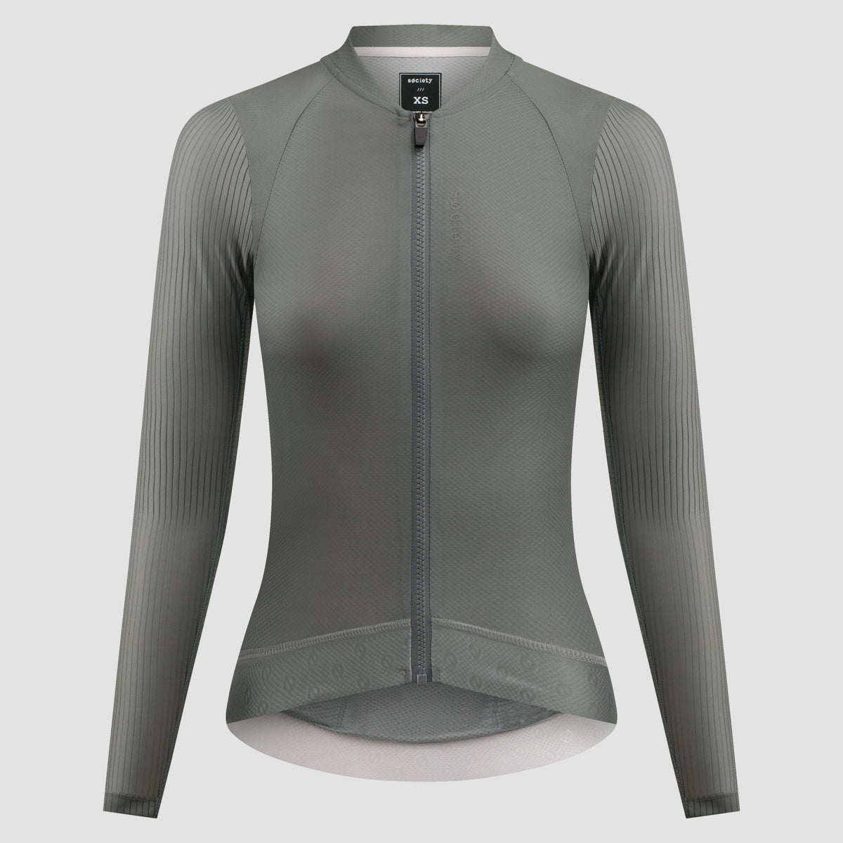 A women's long-sleeve cycling jersey in a muted gray-green color, featuring a full-length front zipper, a stand collar, and vertical ribbed knit sleeves, shown on a neutral light gray background.