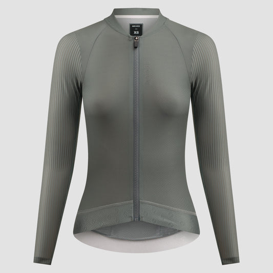 A women's long-sleeve cycling jersey in a muted gray-green color, featuring a full-length front zipper, a stand collar, and vertical ribbed knit sleeves, shown on a neutral light gray background.